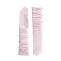 Pair of pink gloves with pearl embellishments on a white background